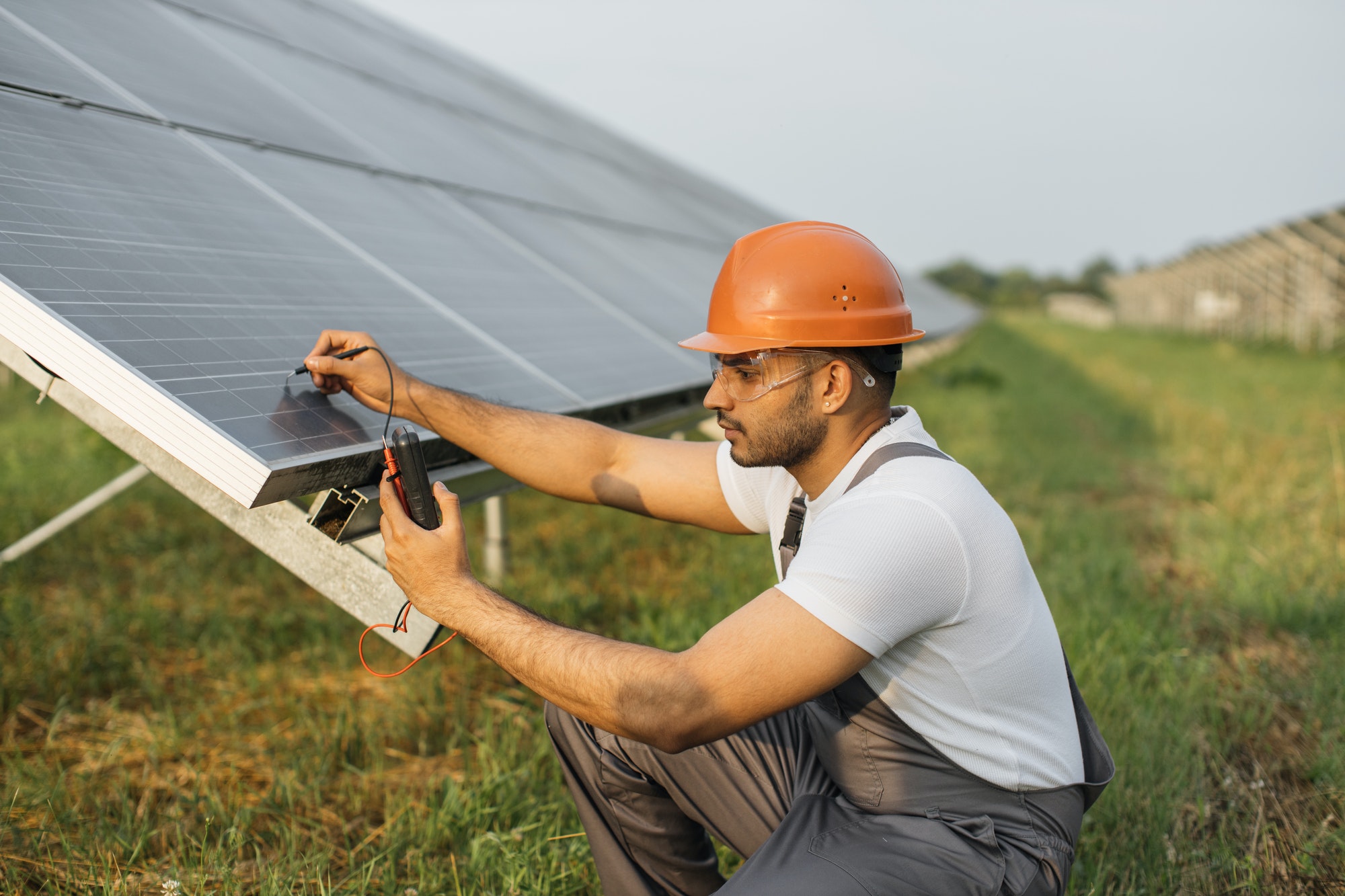 technician-measuring-amperage-of-solar-panels.jpg